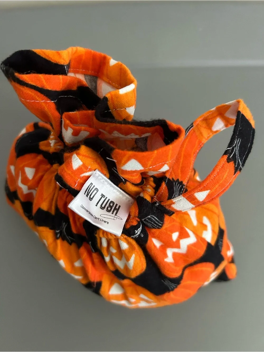 Pumpkin glow in the dark costume shopping cart liner with matching handbag